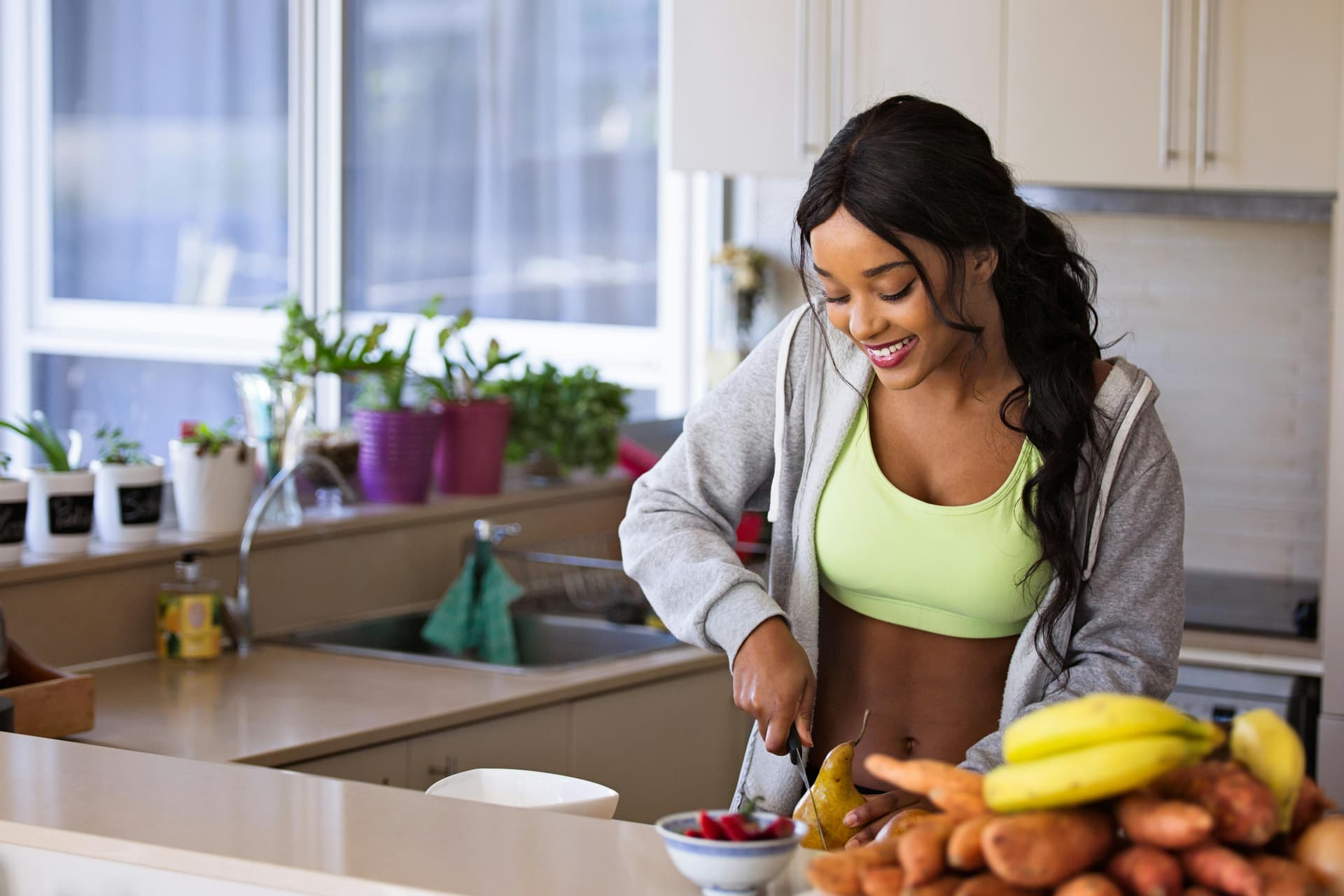 Woman holding a placard written food is fuel.